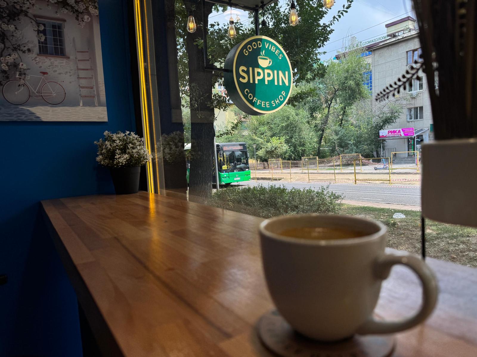 Coffee by the window — Sippin Coffee Almaty