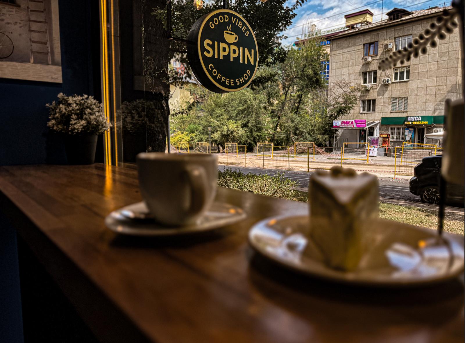 Espresso and cake with a street view — Sippin Coffee Almaty